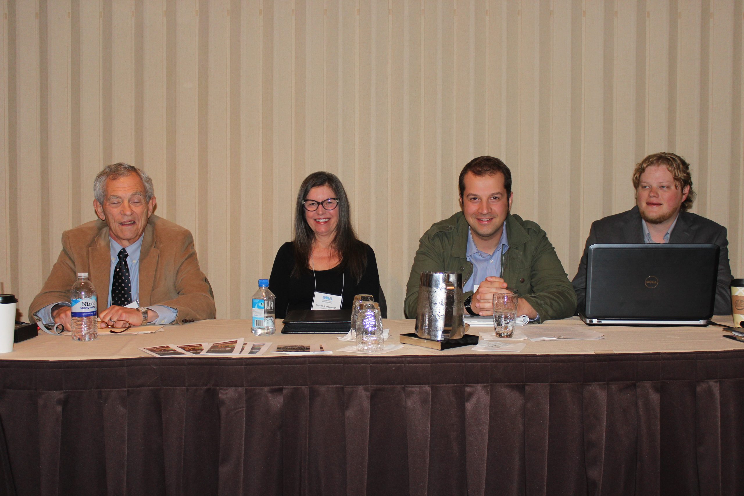 Sitting at a presenters table at the Oral History Association Annual Meeting, 2014: Prof. Michael Gordon (University of Wisconsin-Milwaukee, Emeritus), Sheree Scarborough (Oral Historian), Scott Price (OHC Researcher), Kent Davies (OHC Technician).