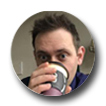 Brett Lougheed sipping coffee to-go cup enclosed in a circle